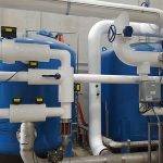 Blue water softener tanks at Clemens Food Group