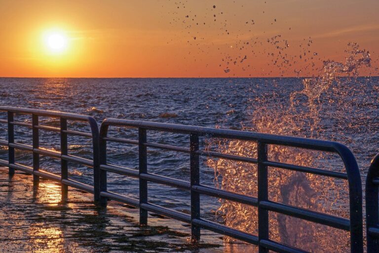 Beautiful sunset and water splashing off the north pier in St. Joseph