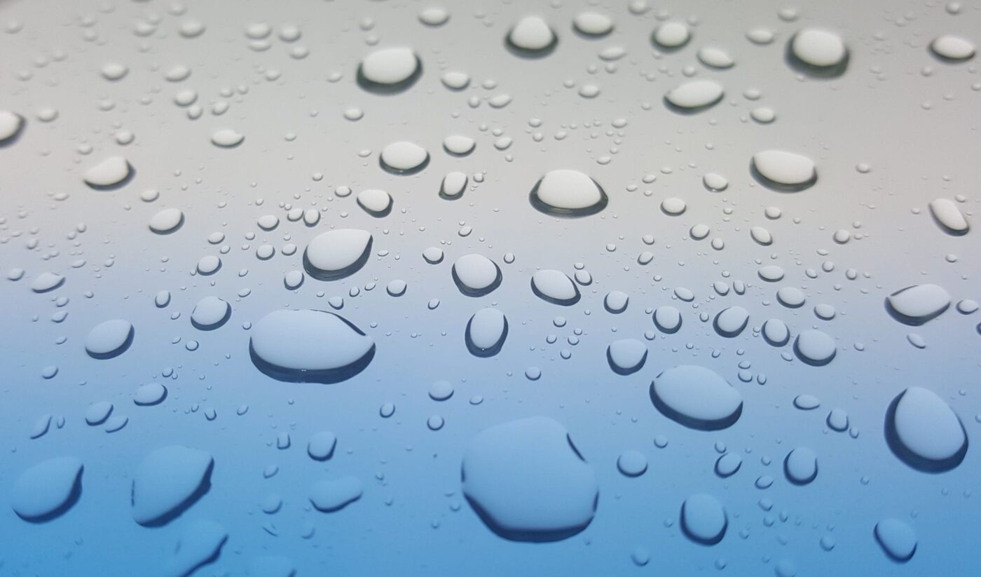 water droplets on a silver and blue background