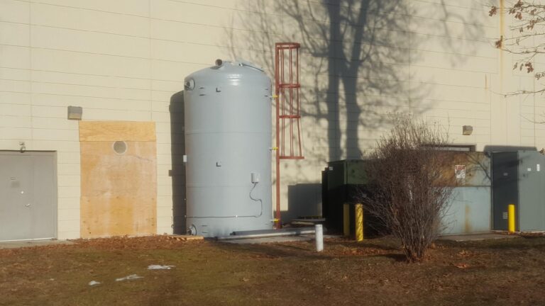 a photo of a brine silo outside a research facility