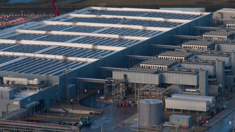 Aerial drone video of a large data center building exterior